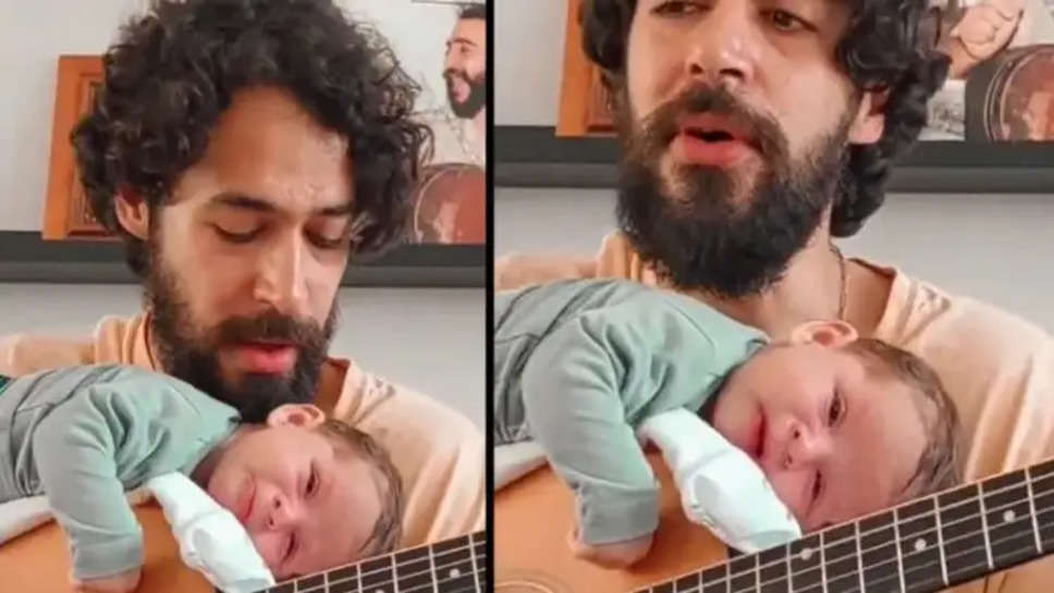 गिटार की धुन पर पिता ने सुनाई अपने कलेजे के टुकड़े को लोरी दिल जीत रहा है वीडियो
